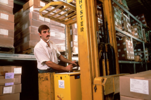 worker operating a forklift in a warehouse