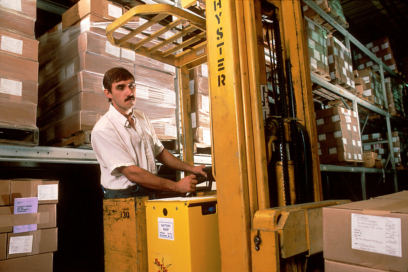 A man operating a forklift in a warehouse