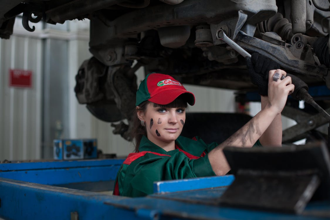 woman quality control in charge at an automotive facility
