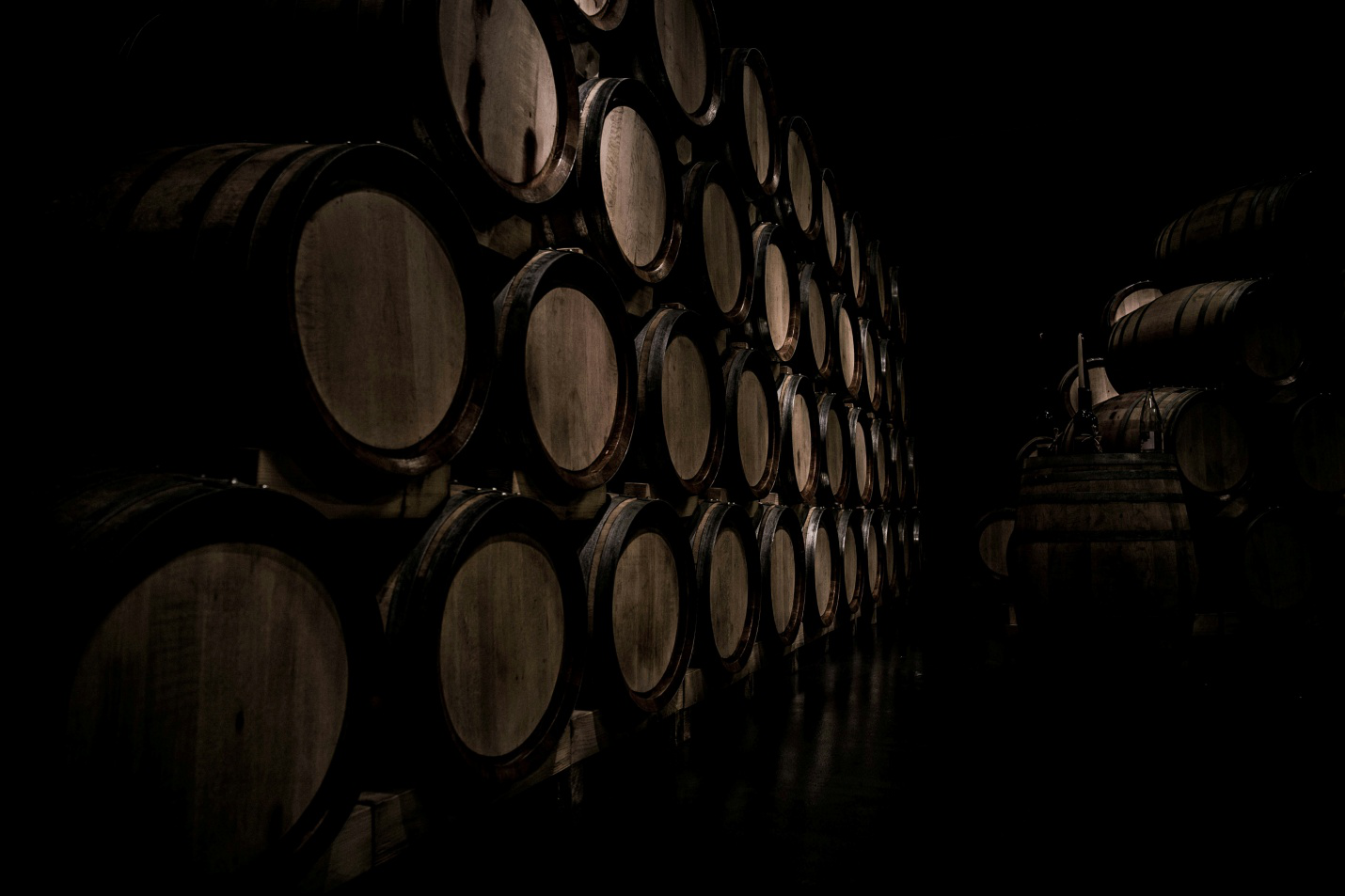 A pile of barrels in a warehouse