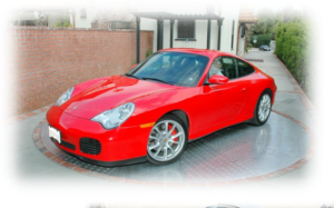 A modern vehicle turntable installed in a residential driveway for optimized parking.