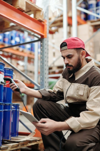 A warehouse employee checking stock using a tablet