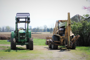 two-machines-parked Alt-text: two machines parked outdo