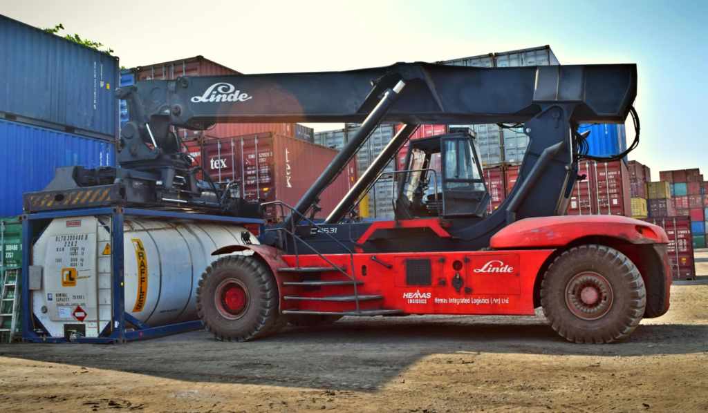An excavator lifting a heavy object
