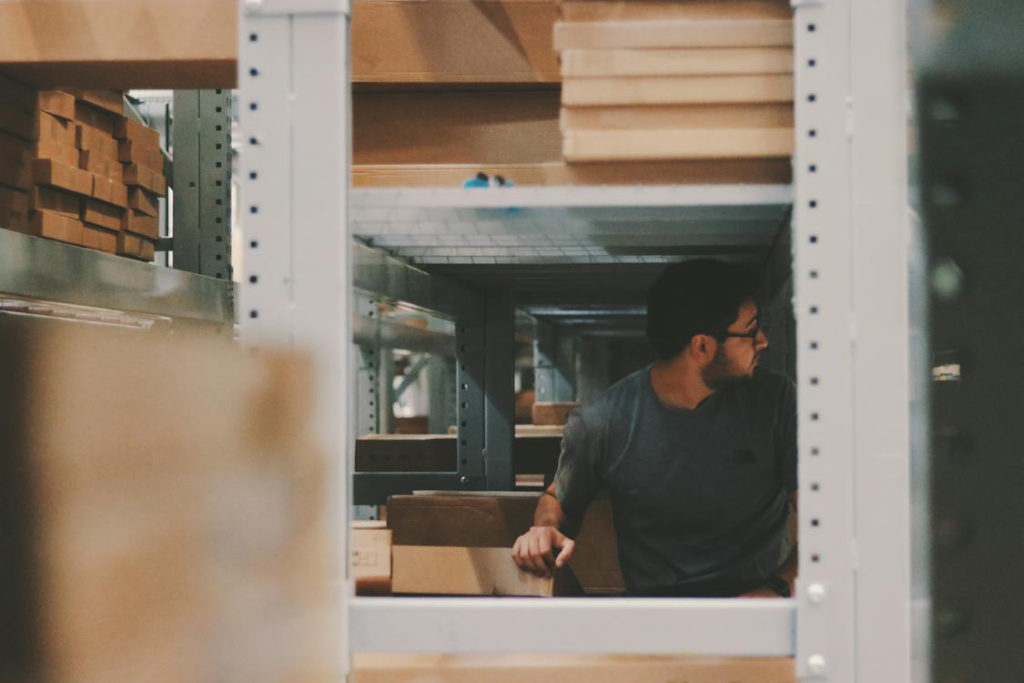 Man organizing shelves in a warehouse