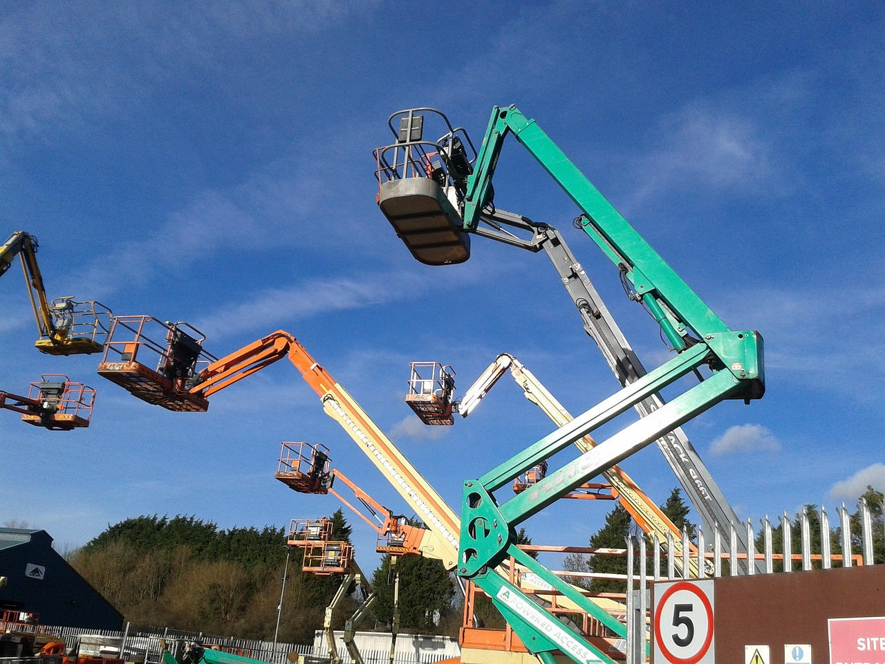 Several cranes parked near one another