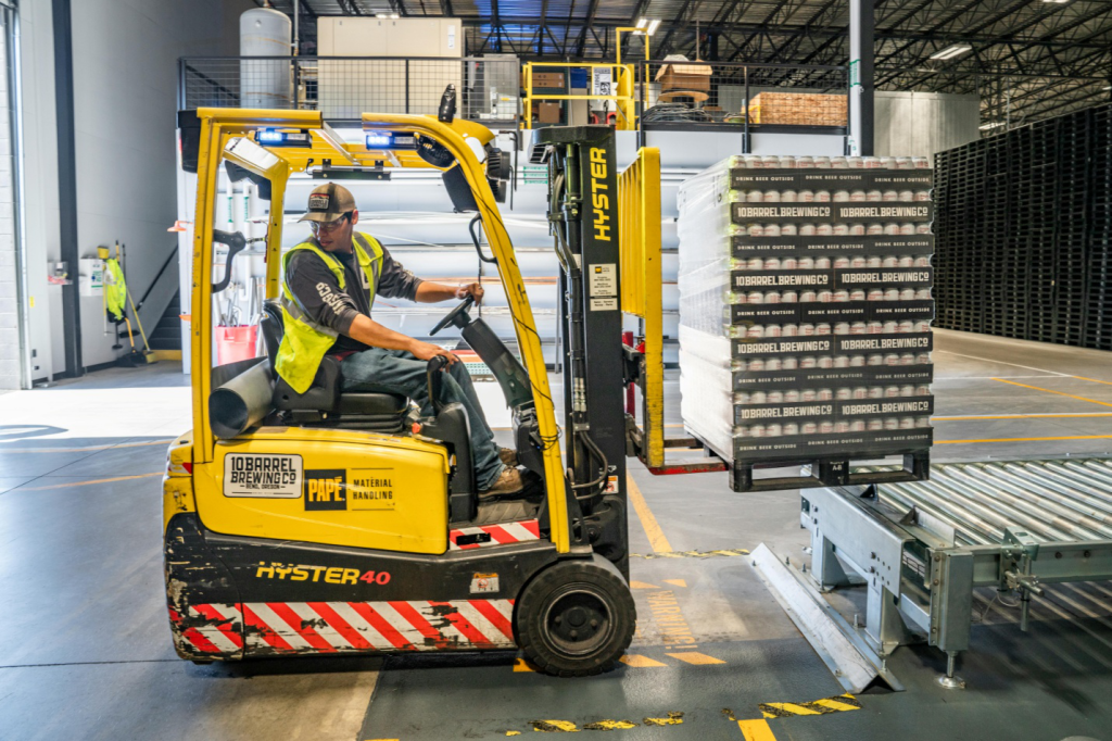 A man operating a forklift in a warehouse