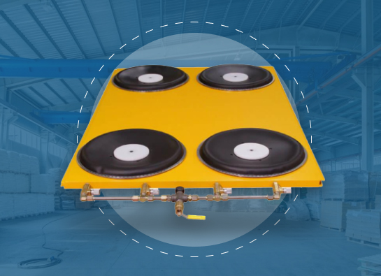 Yellow industrial air caster system with four black air bearings mounted on a platform featuring an integrated air distribution system.